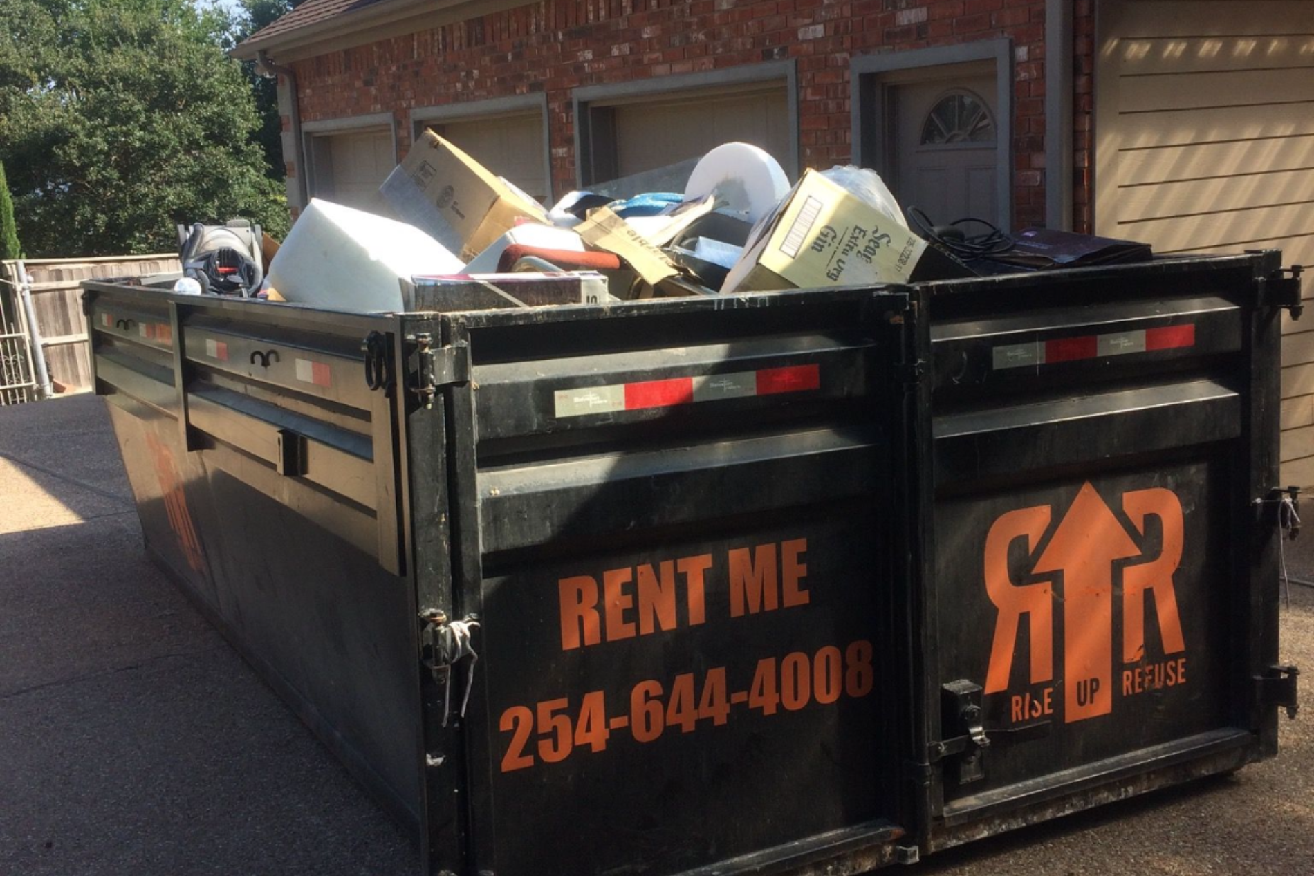 black filled dumpster